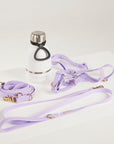 purple dog lead, harness, and botte
