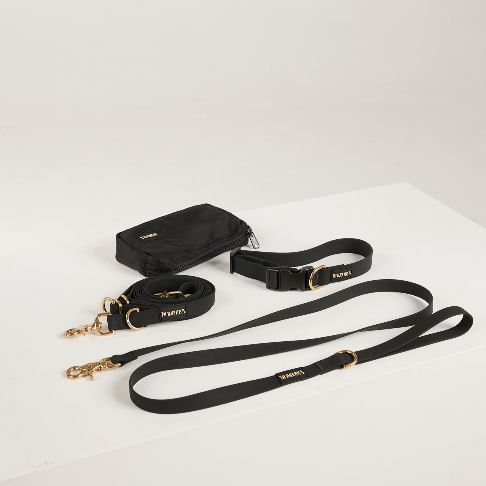 black  dog collar, dog lead and dog poop bag pouch