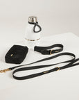 black dog lead, dog collar, bottle and poop bag