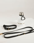 White water bottle with black leash on a light gray background