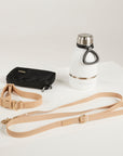sand dog lead, dog collar, bottle and poop bag