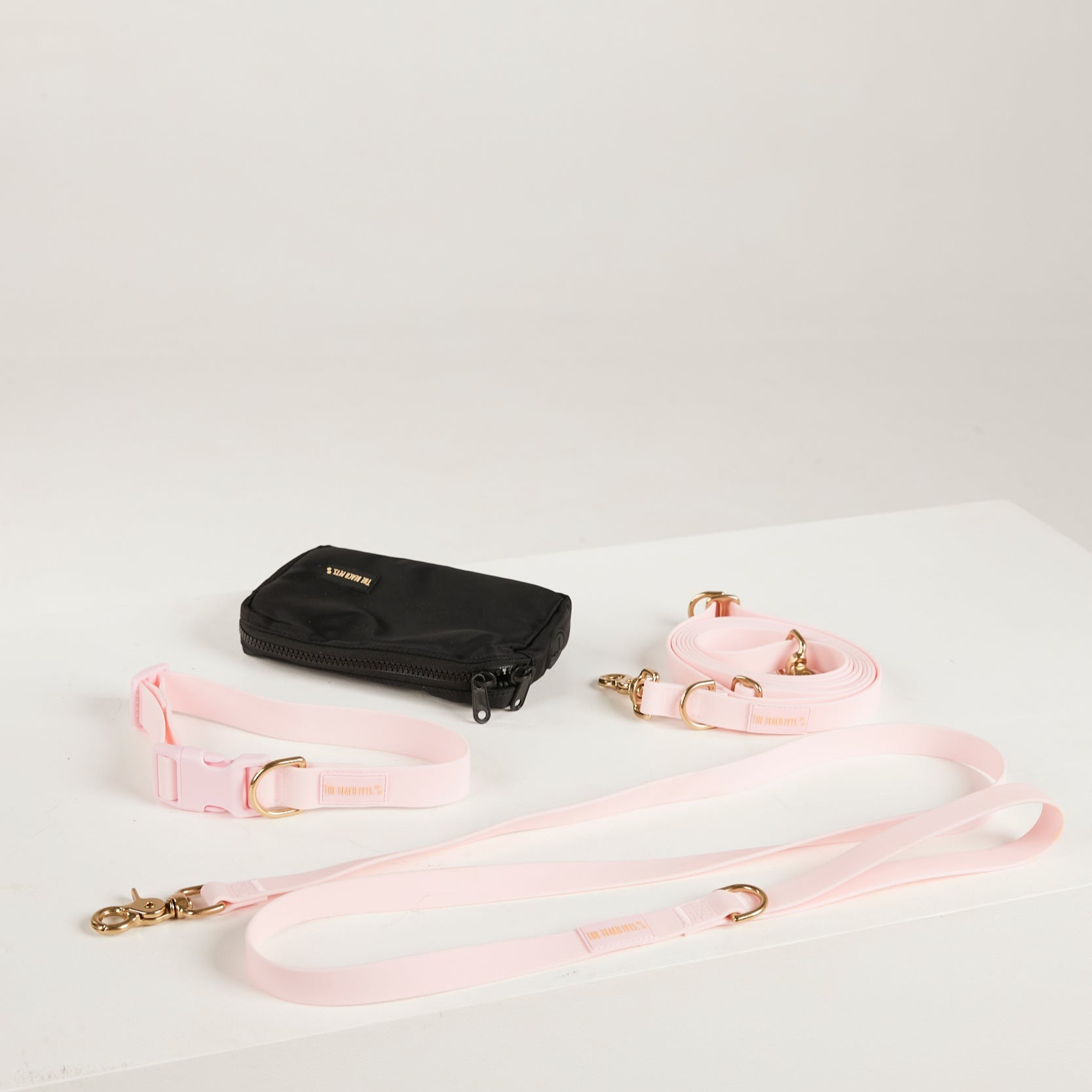 pink  dog collar, dog lead and dog poop bag pouch