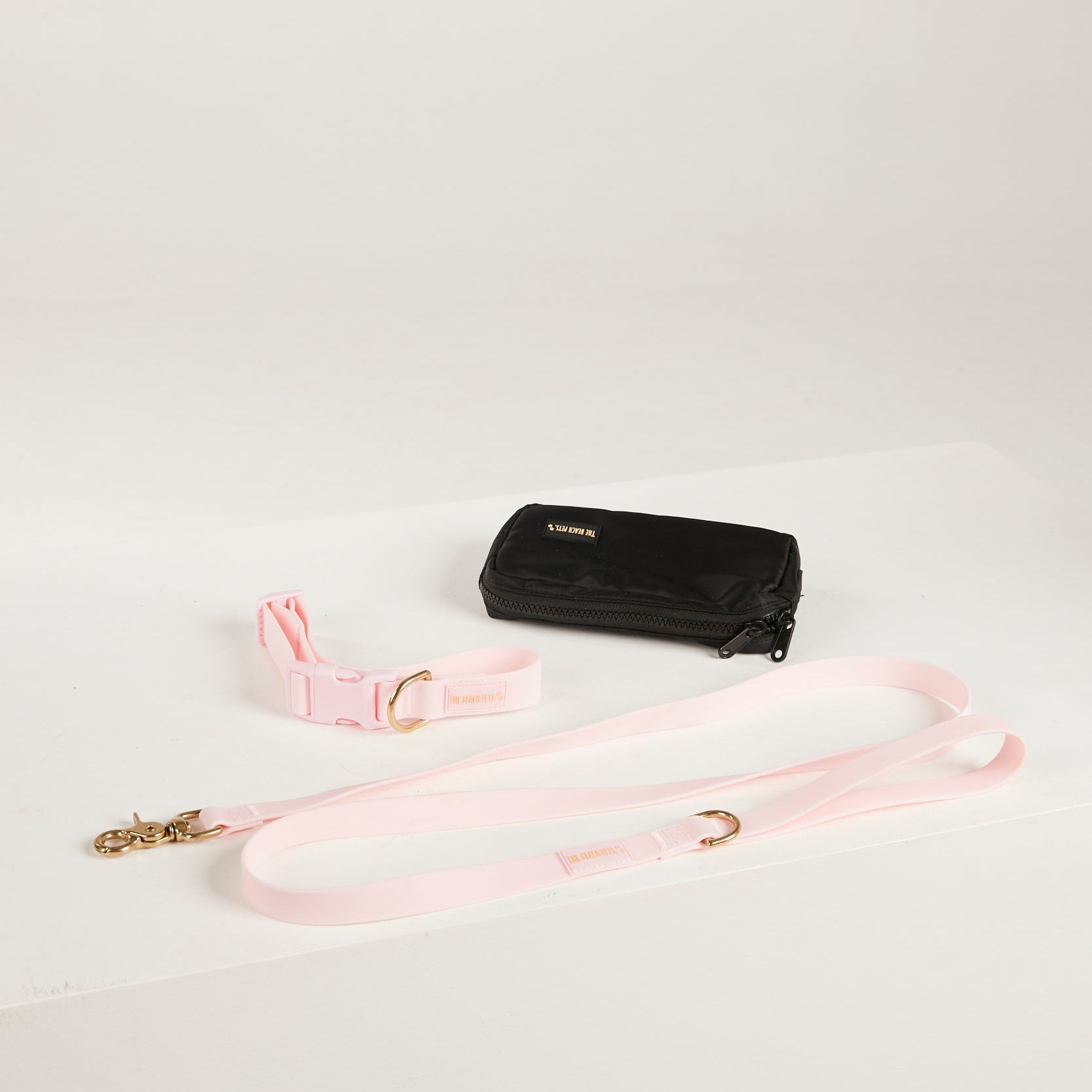 pink lead, waterproof collar, dog poo bag