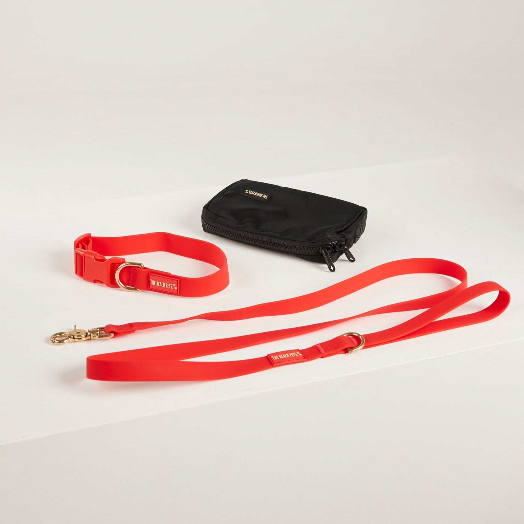 red lead, waterproof collar, dog poo bag