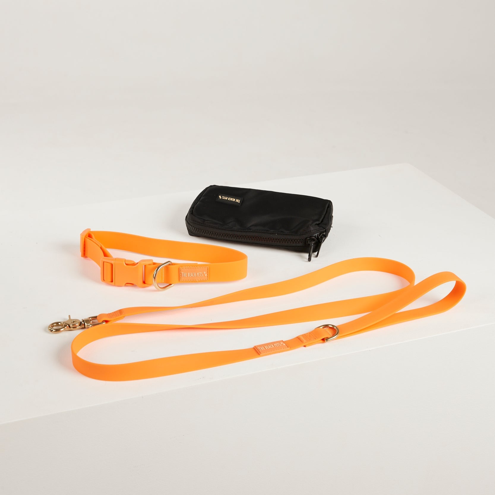 orange lead, waterproof collar, dog poo bag