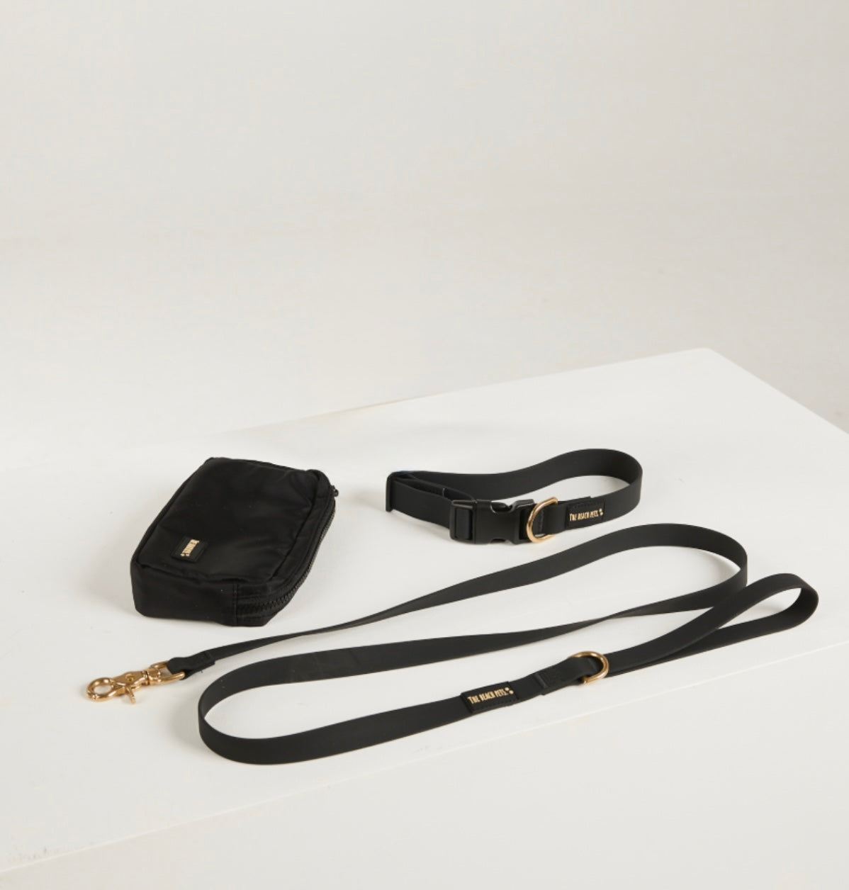 black lead, waterproof collar, dog poo bag