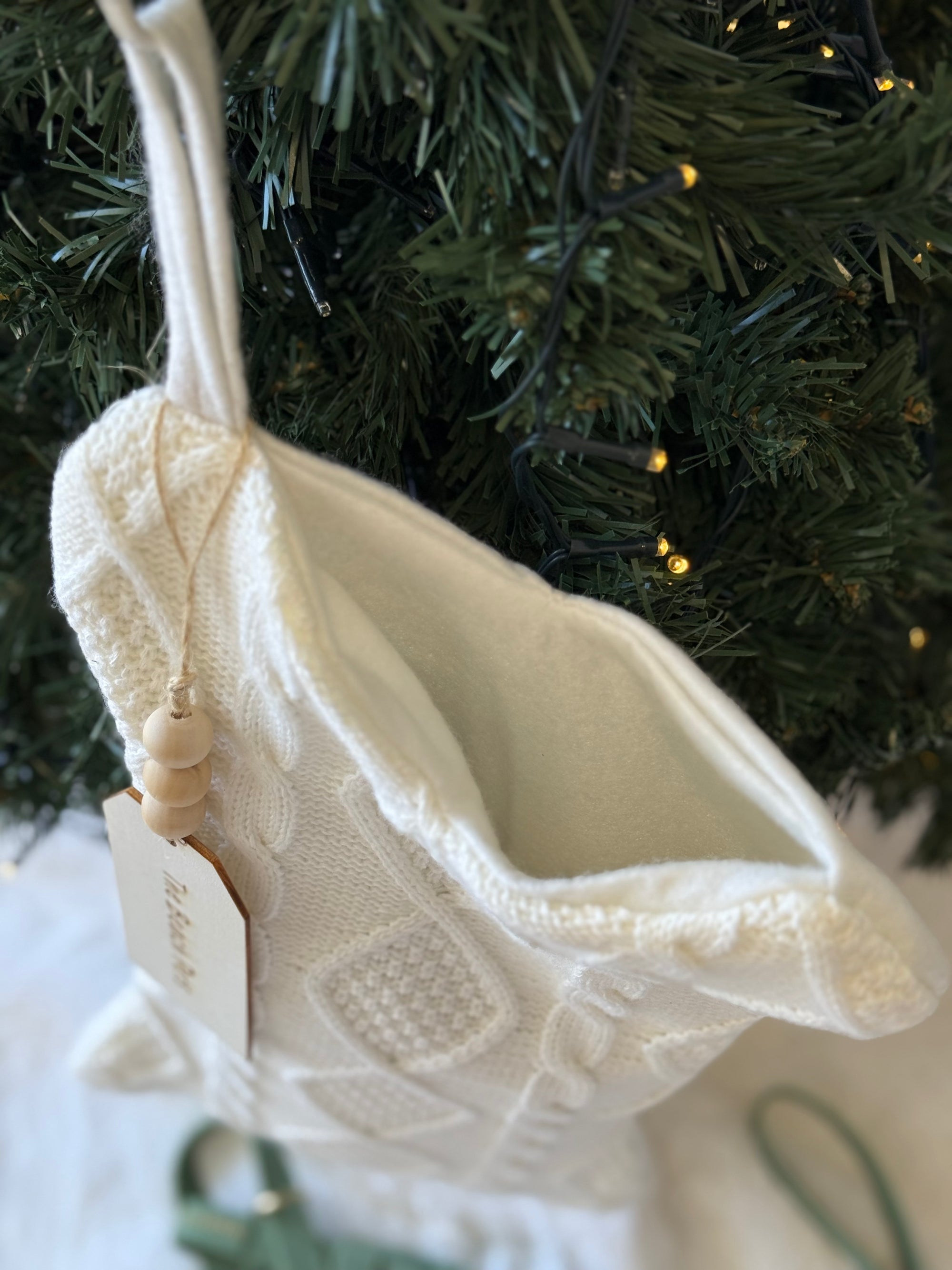 dog christmas stocking hanging on a Christmas tree