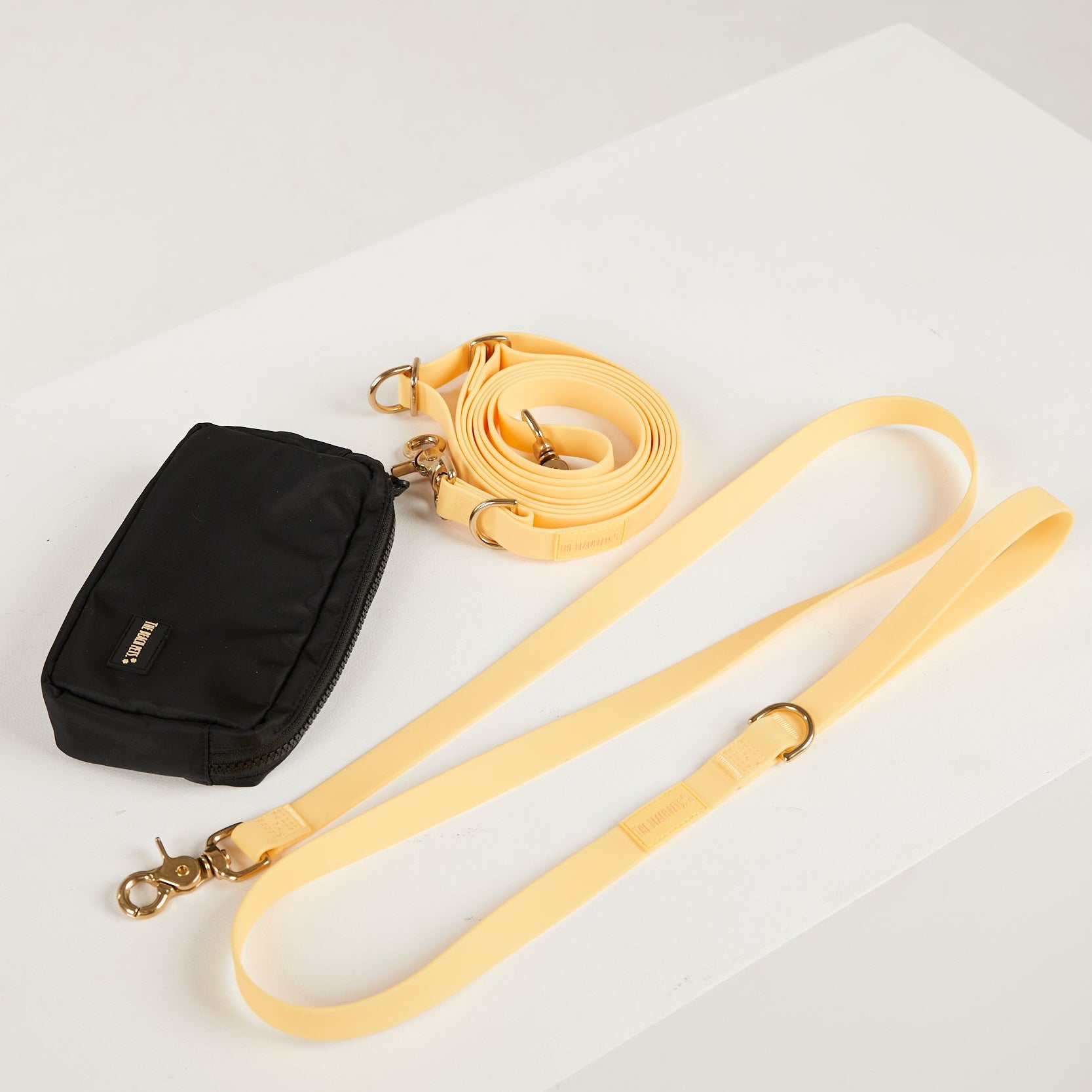 yellow waterproof dog leash, poop bag 