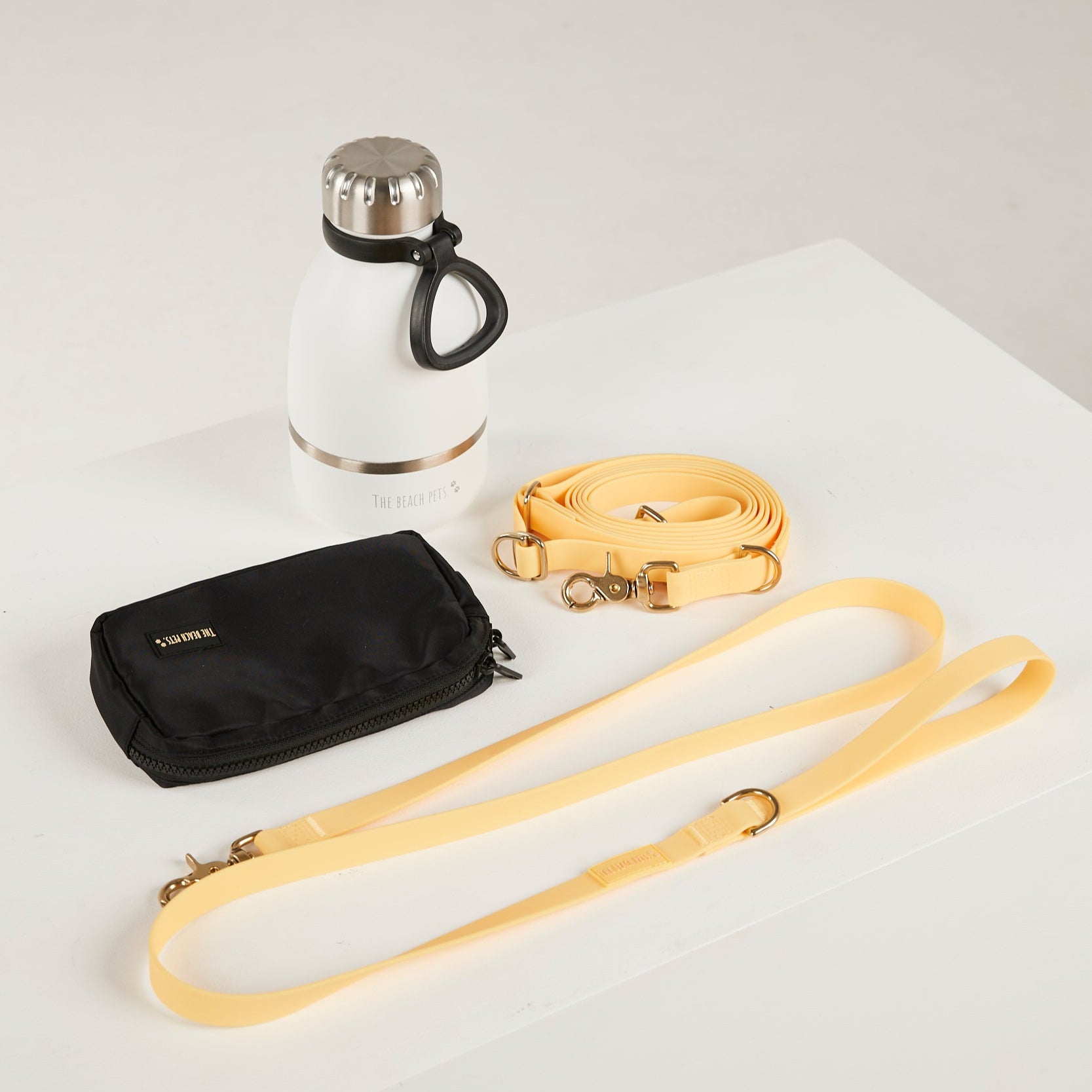butter yellow dog lead, hands free lead, poop bag, bottle 