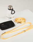 butter yellow dog lead, hands free lead, poop bag, bottle 