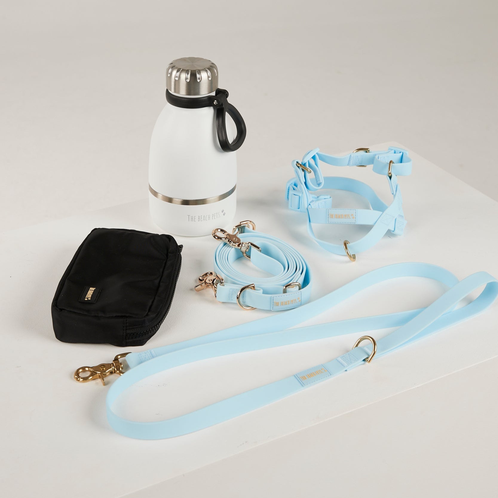 blue dog lead, dog water bottle, dog harness, dog poo bag pouch 