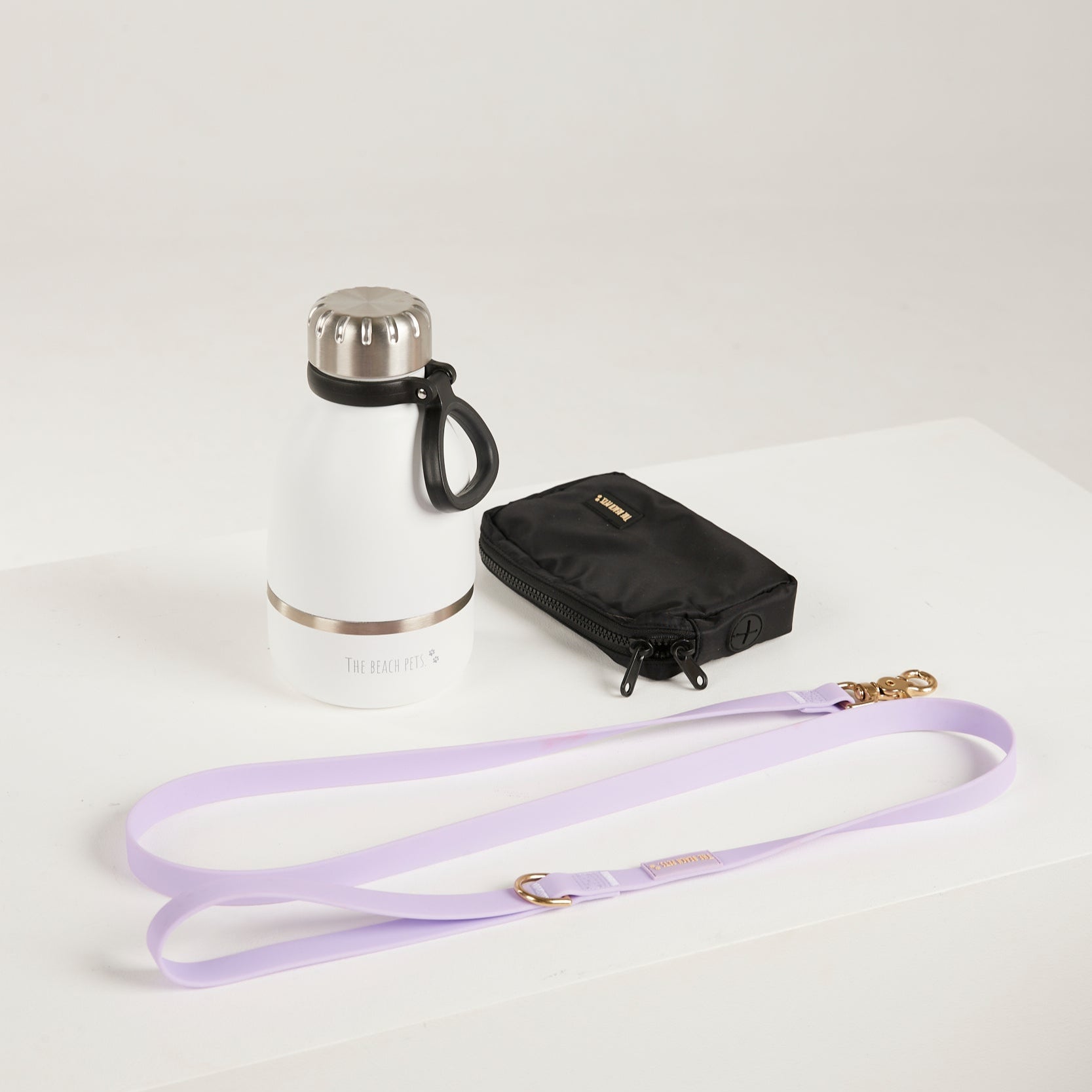 lilac  dog leash, dog poop bag and dog waterbottle