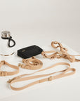 Dog leash and water bottle on a white background