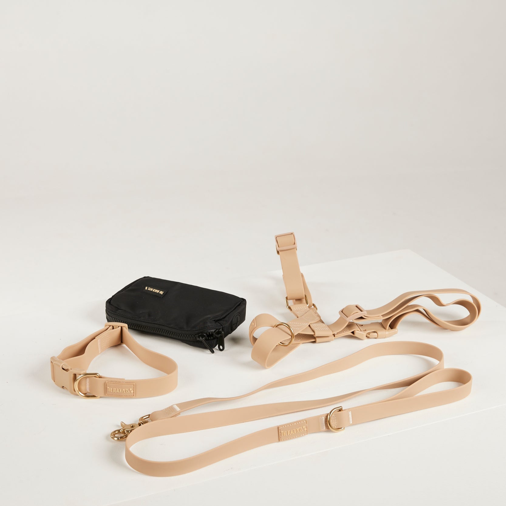 sand dog collar, dog harness, dog leash and poop bag 