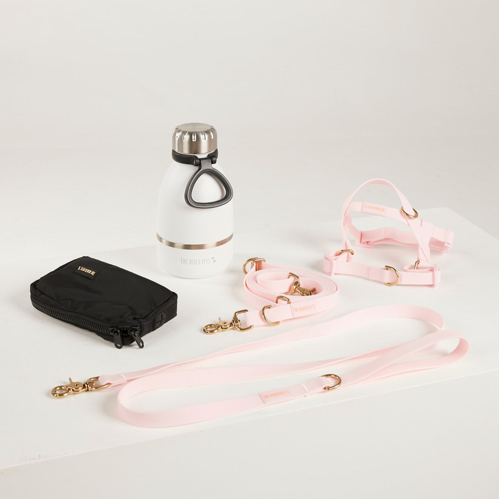 pink dog lead, dog water bottle, dog harness, dog poo bag pouch 