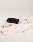pink dog lead, harness and poop bag
