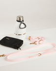 pink dog lead, hands free lead, poop bag, bottle 