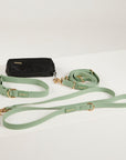 green  dog collar, dog lead and dog poop bag pouch