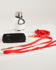 red dog lead, hands free lead, poop bag, bottle 
