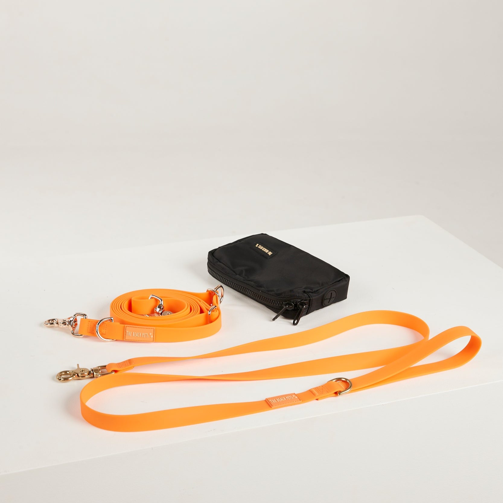 orange yellow waterproof dog leash, poop bag