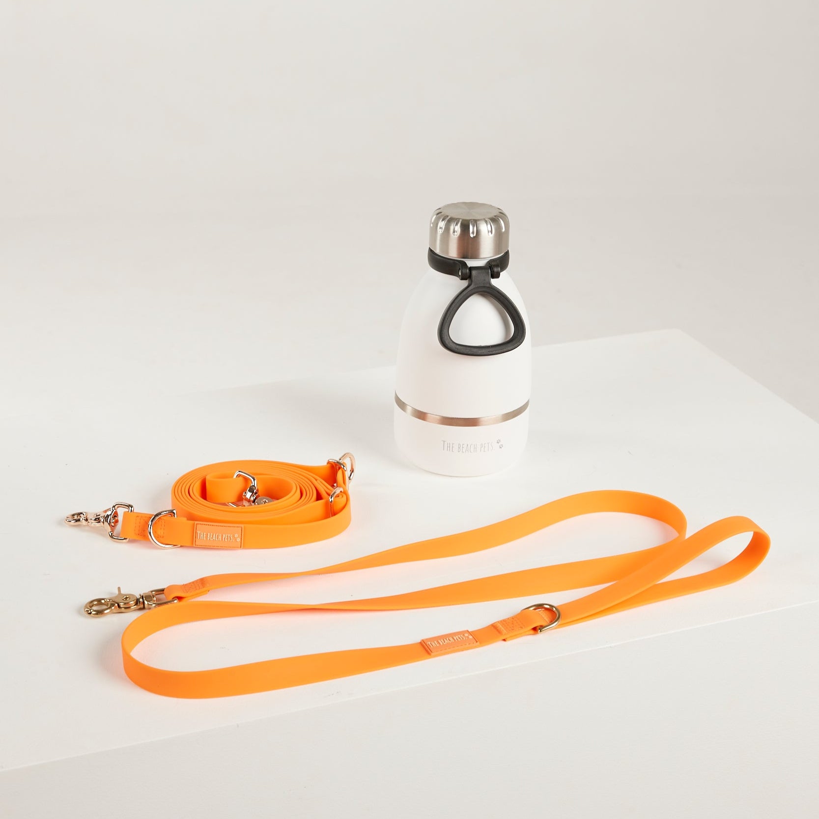 orange  waterproof leads, water bottle with detachable dog bowl