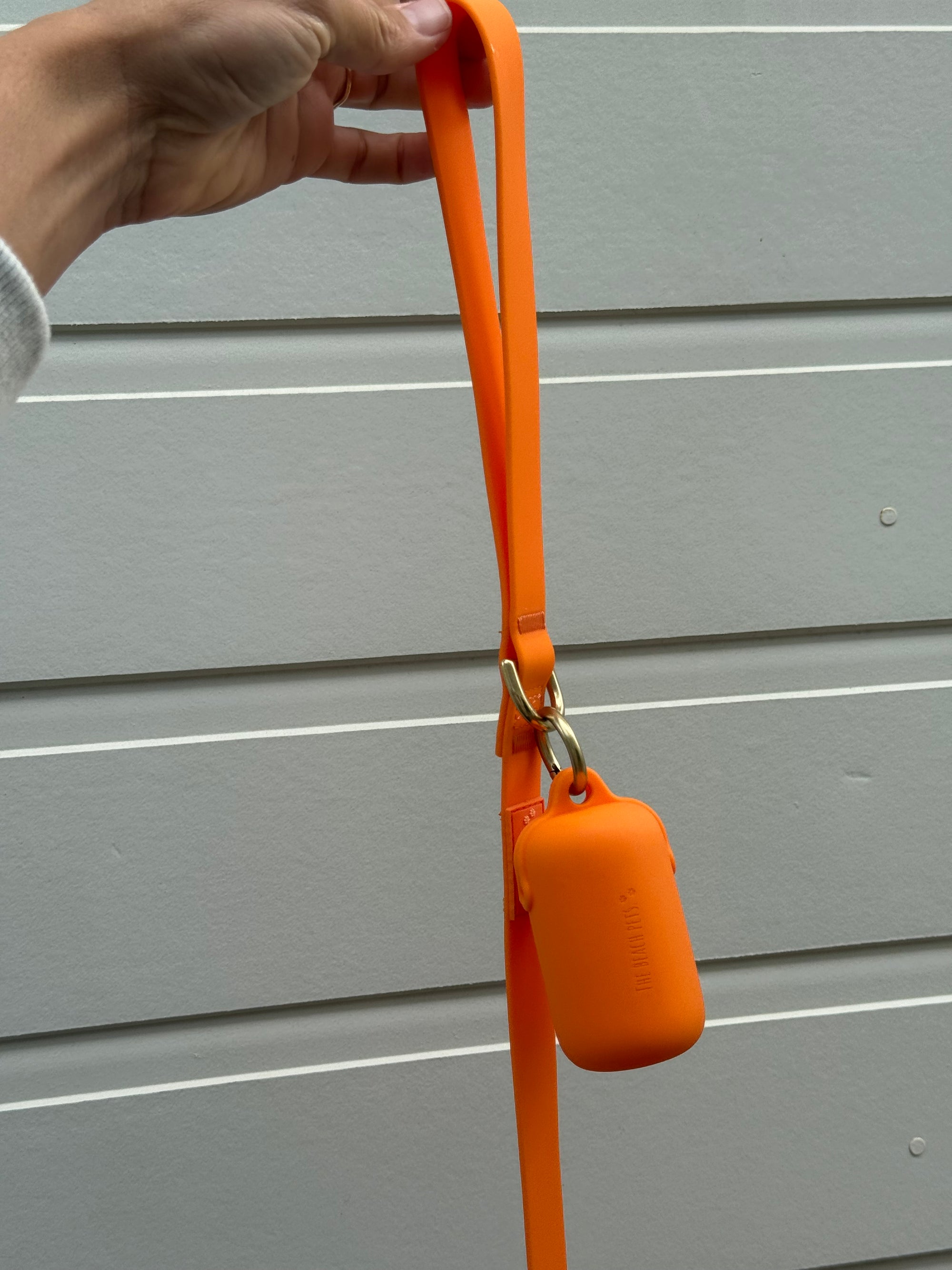 orange waterproof poop bag holder